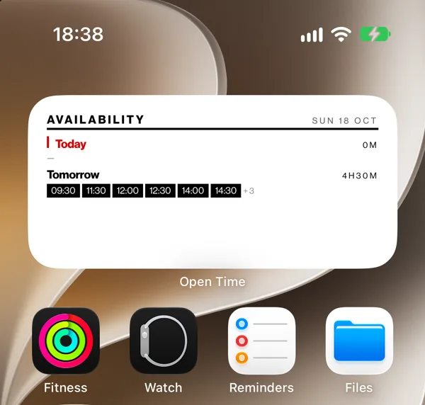 An iPhone Home Screen with the OpenTime widget at the top: tomorrow has 4 hours 30 minutes free, starting at 9:30